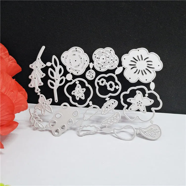 Silver carbon steel flower pattern paper cutting die measuring 14.3 by 9.9 centimetres