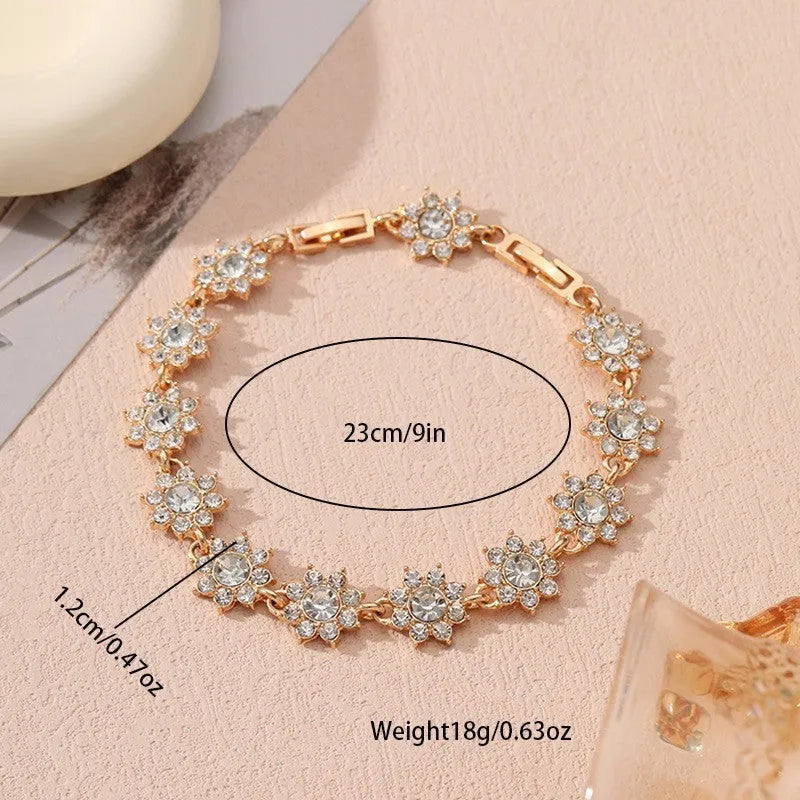 Floral zinc alloy bracelet with electroplated gold or silver finish and gemstone colour variants