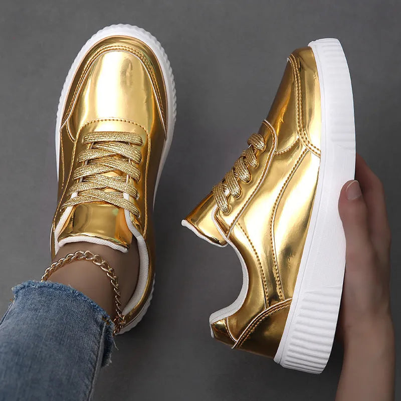 Rose gold platform sneaker with sequin details and a thick, light-coloured sole.