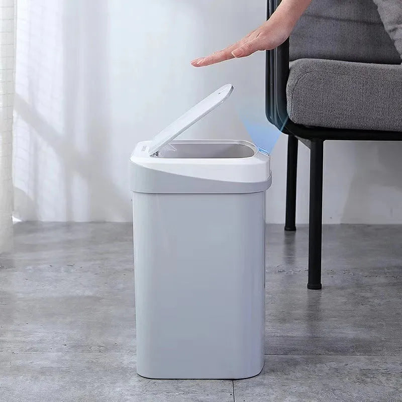 Smart induction trash can in black plastic with lid open, for kitchen or bathroom