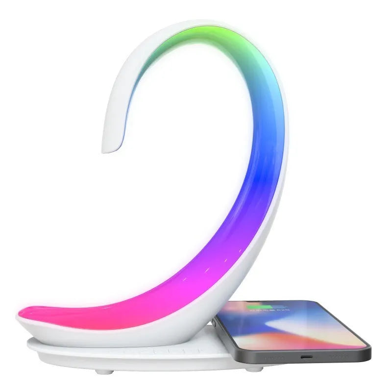 White swan-shaped desk lamp with colourful LED lights, Bluetooth speaker, and wireless charging pad.
