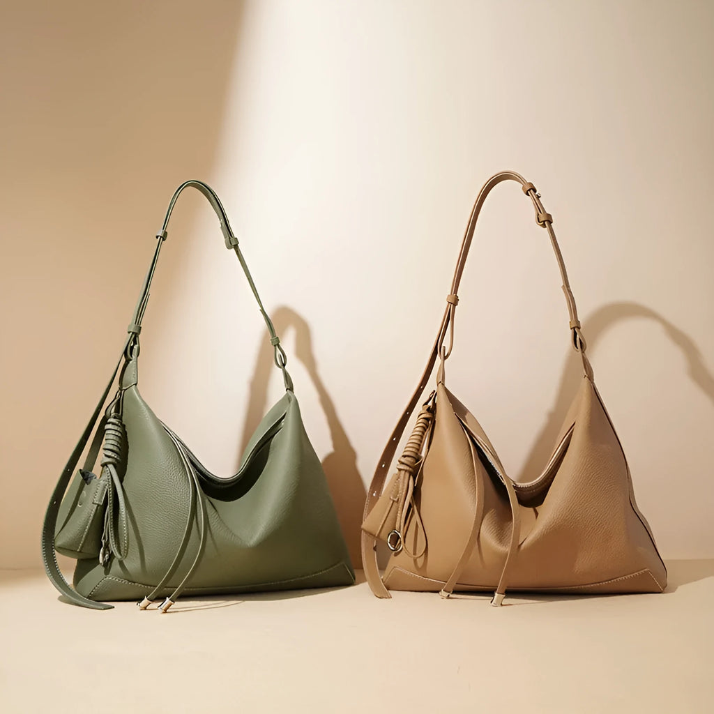 Full-grain leather women's crossbody bag in biscuit with spliced design and zip closure
