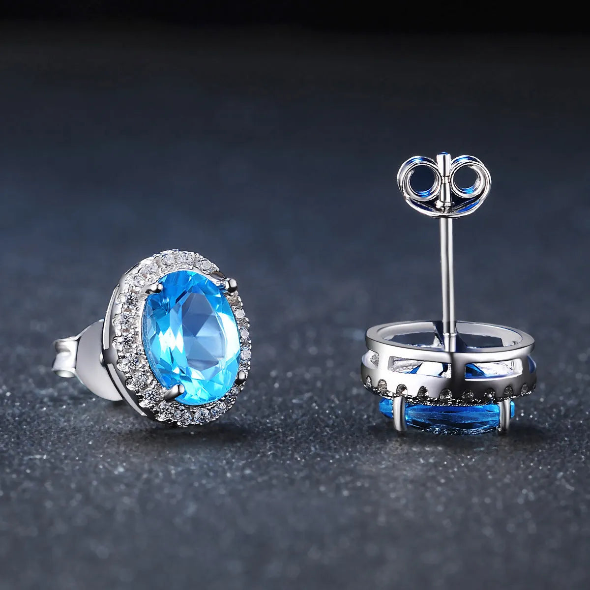 925 sterling silver jewellery set with blue topaz stones including geometric earrings, necklace, ring and pendant