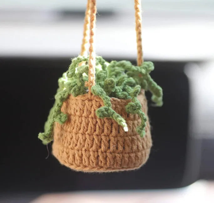 Green and white knitted rope car plant ornament with 8cm base and hanging rope.