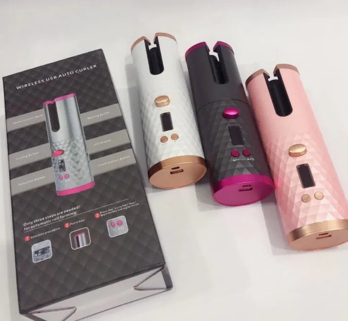 White portable automatic curling iron with USB charging cable and gold ceramic curling barrel.
