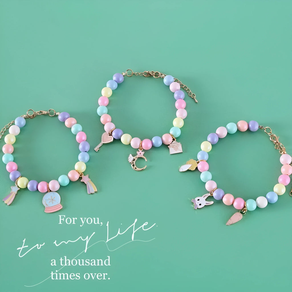 Colourful macaron charm pet collar and matching bracelet set in resin on a white background.
