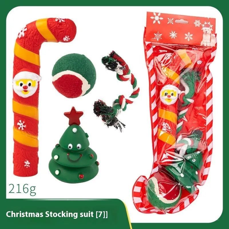 Christmas vinyl dog toy set with Santa Claus heads, trees, tennis balls, and bite ropes