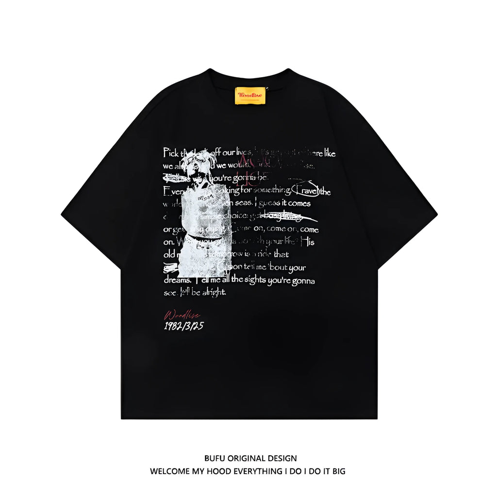 Man modelling a black loose-fit pure cotton T-shirt with a white printed letter pattern and raglan short sleeves