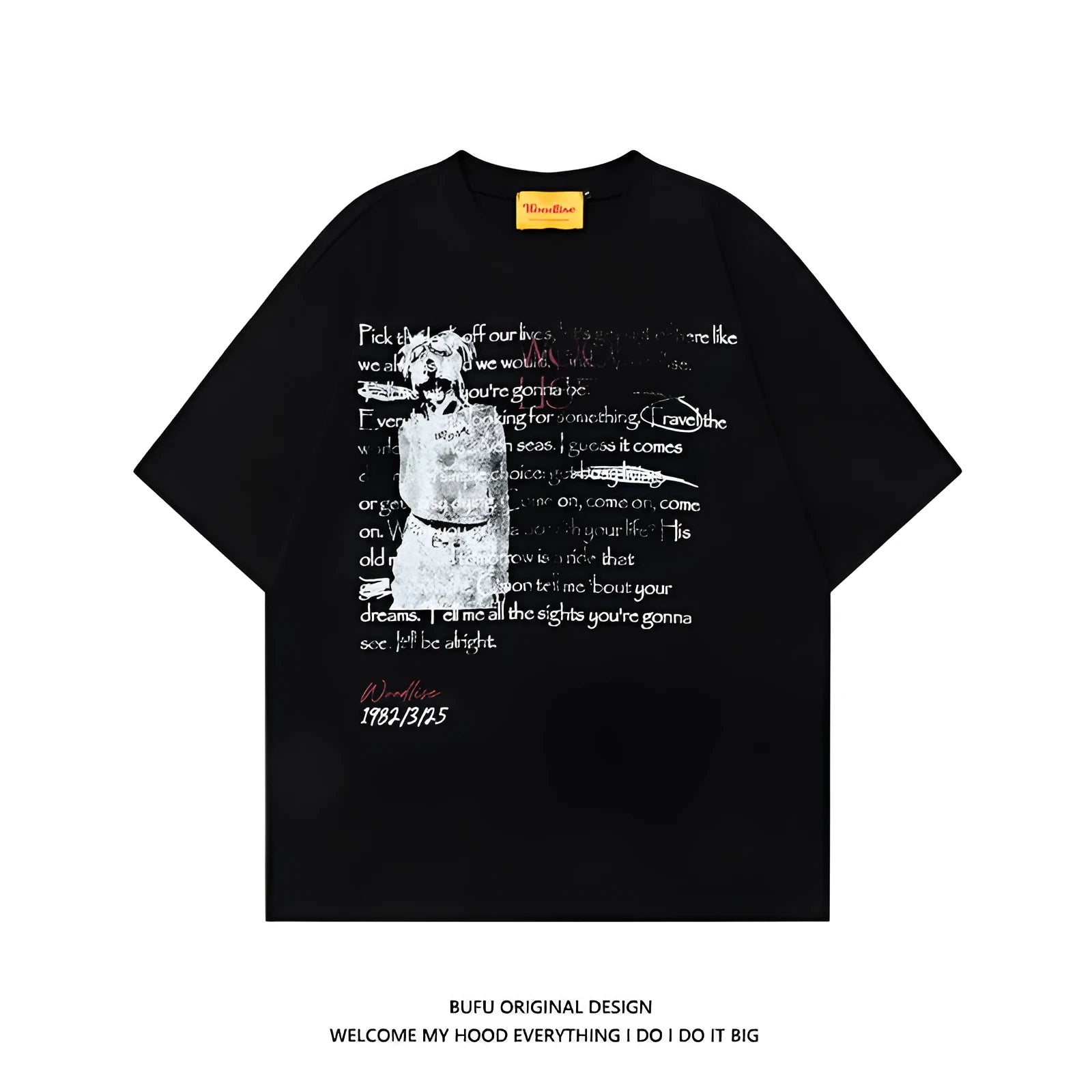 Man modelling a black loose-fit pure cotton T-shirt with a white printed letter pattern and raglan short sleeves
