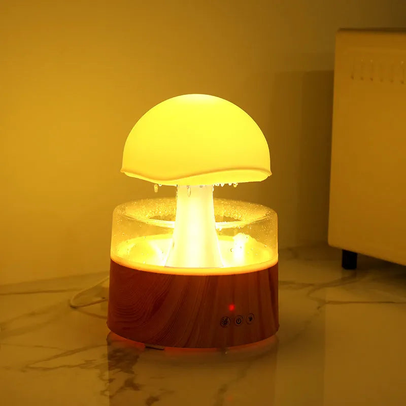 White cloud-shaped humidifier with falling raindrop effect and colour-changing LED lights