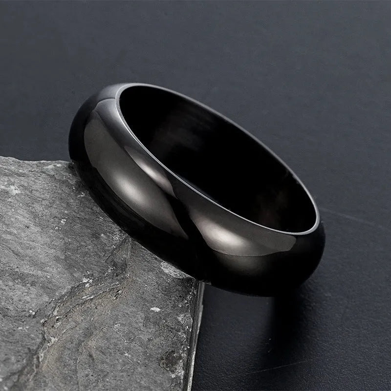 Glossy electroplated titanium steel ring in gold, black, or steel colour on a plain background.
