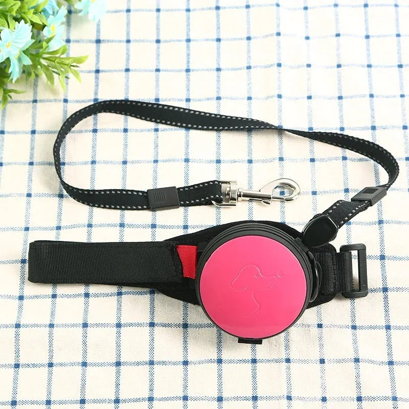 Automatic retractable dog leash extended to 3 metres, shown in vibrant orange colour with ergonomic handle.