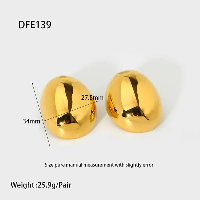 Geometric women's earrings with a gold glazed finish and simple line designs on a white background.