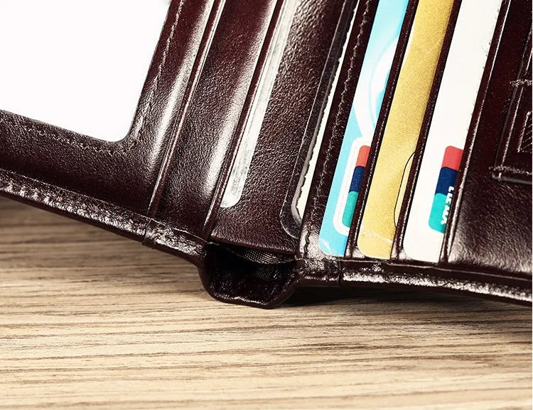 Men's genuine leather wallet open showing multiple internal compartments including card slots and secret pocket