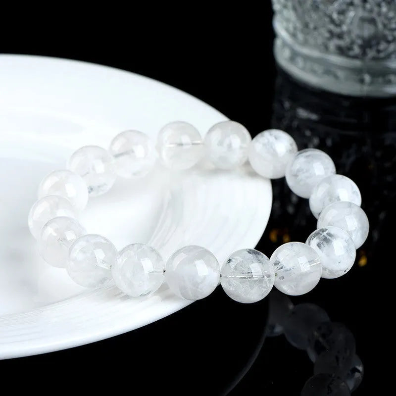 Women's natural blizzard crystal bracelet with geometric beads featuring Ruyi and Xiangyun design.