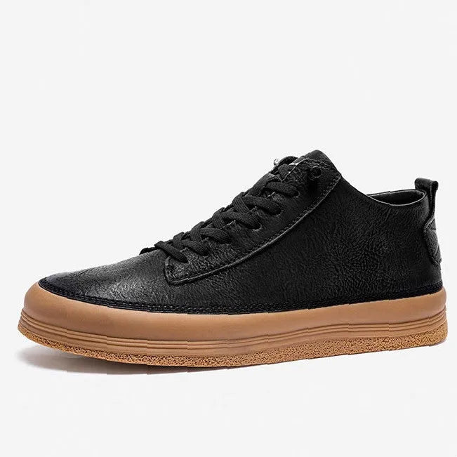 Men's black casual leather shoes with a round toe and white rubber sole on a plain background.