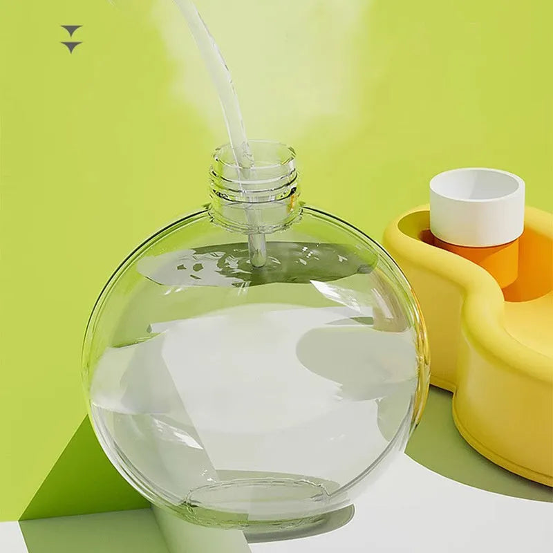 Green portable dog travel water bottle with integrated drinking bowl dispenser.