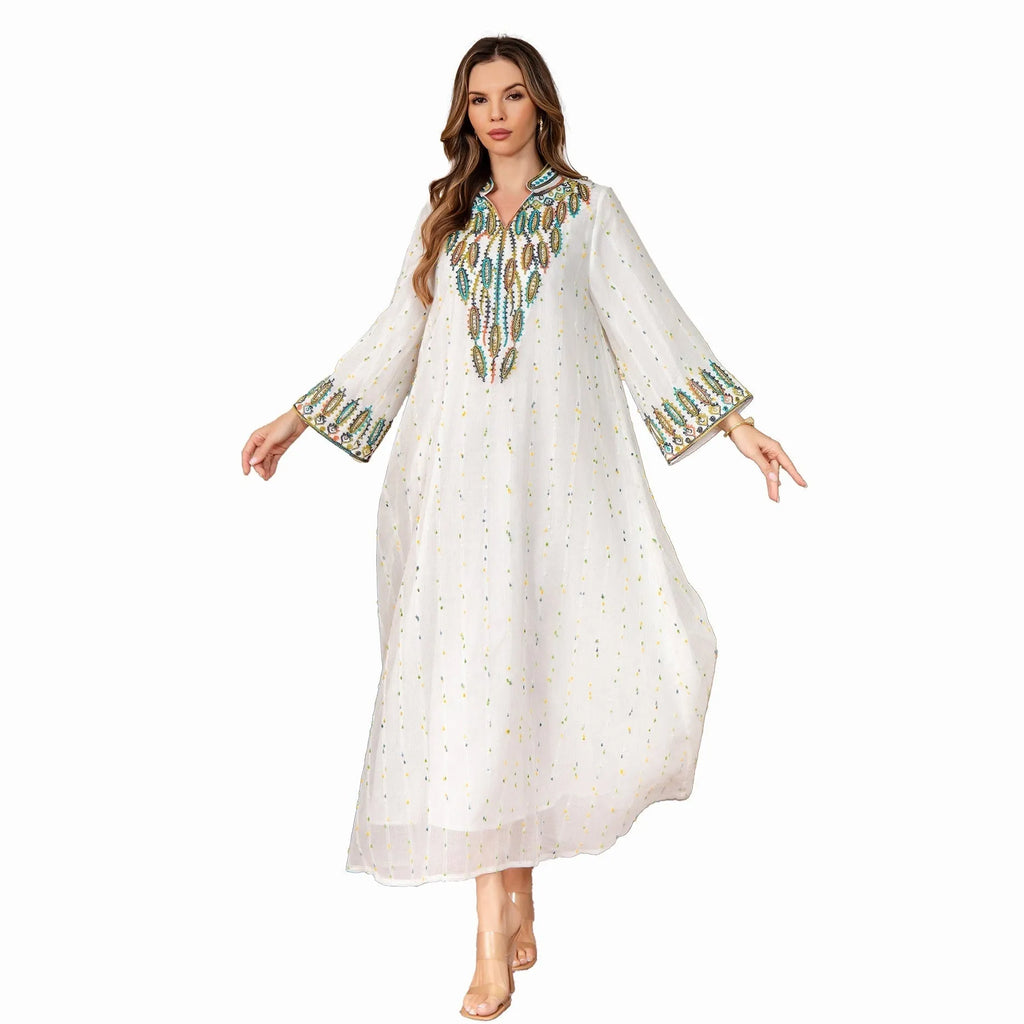 White long sleeve long skirt Arabic robe for women on a hanger.
