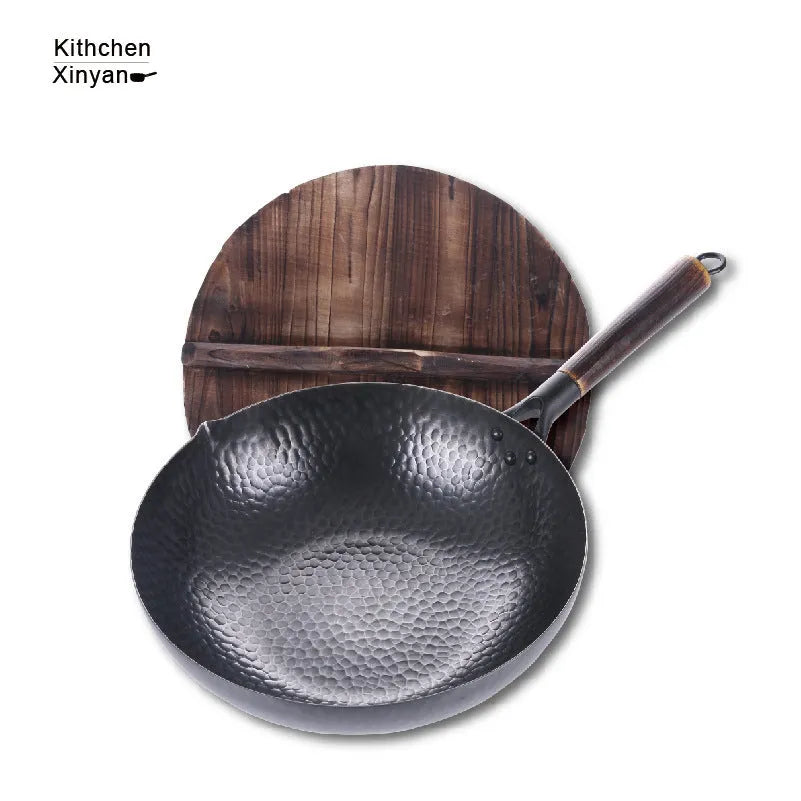 Traditional handmade iron wok pan with wooden handle and induction-compatible base