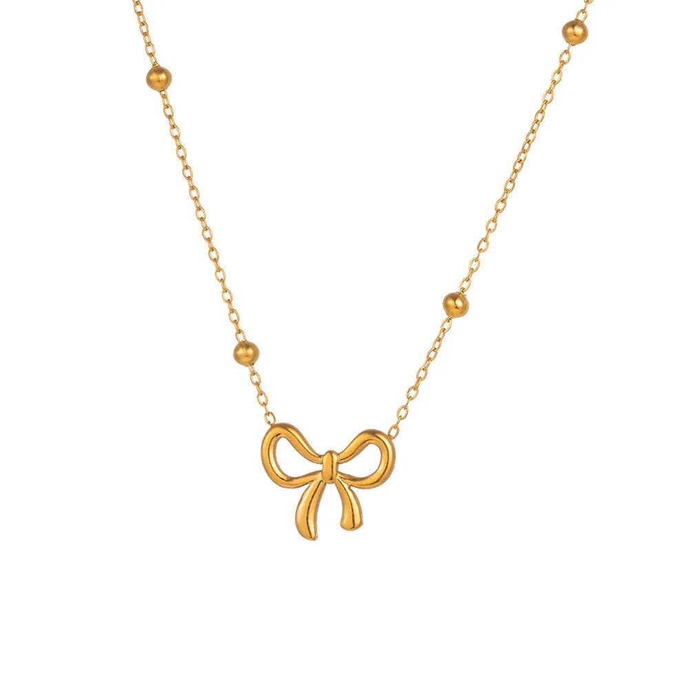 Gold electroplated bow necklace with cross chain design on adjustable 41-50cm chain