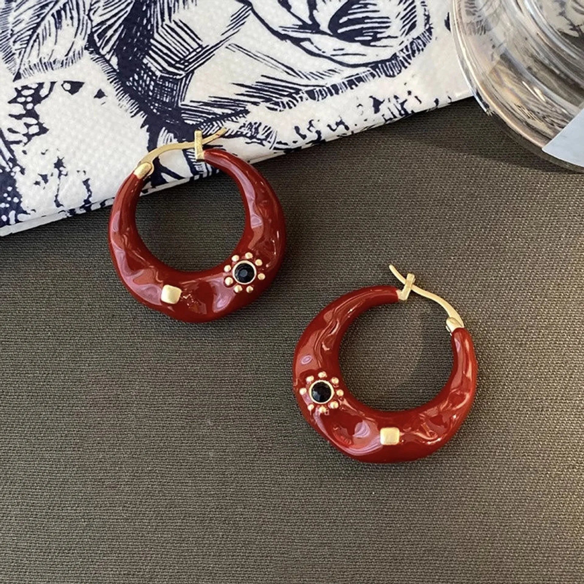 A pair of retro Hong Kong style alloy ear studs with rhinestone inlay, shown in black and red colour options.