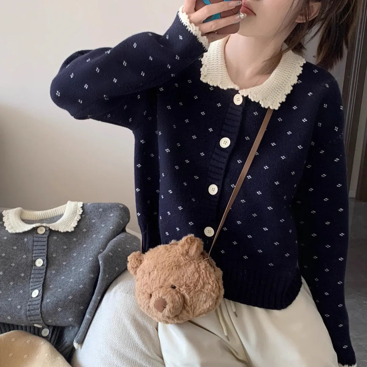 Retro floral patterned knitted cardigan coat with a Peter Pan collar and button front.
