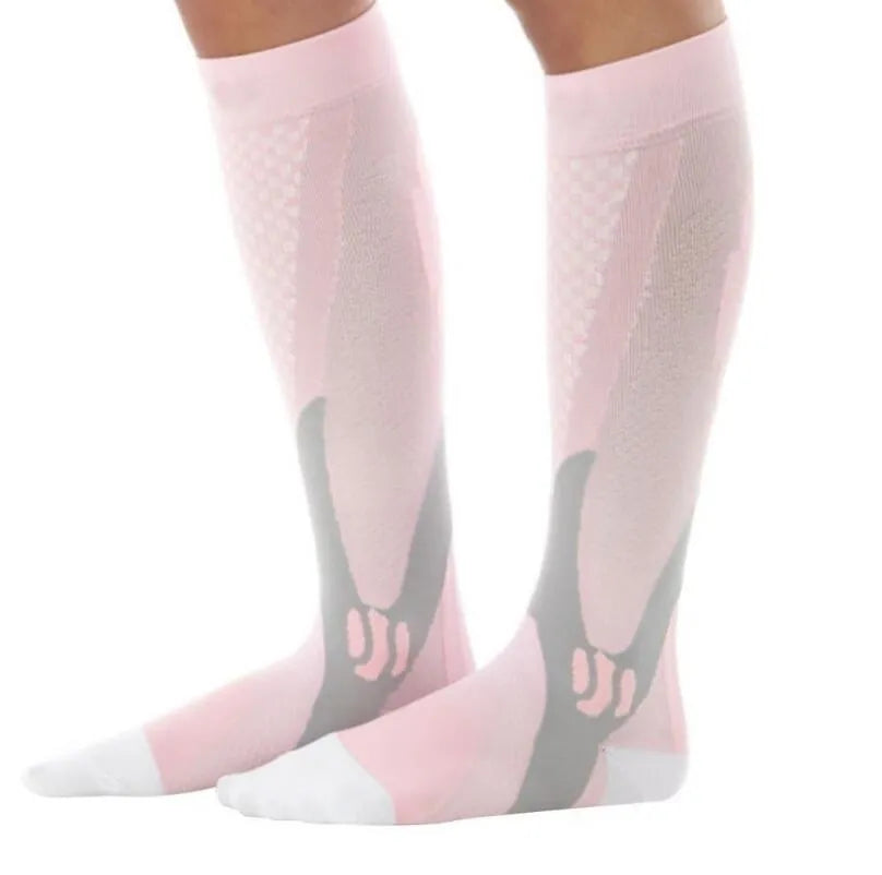 Graduated compression socks for men and women in black, shown laid flat.