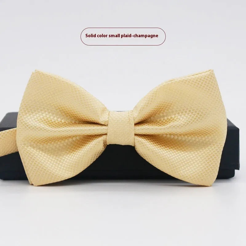 Men's flat head style polyester bow tie in a solid colour, shown with adjustable neck strap.