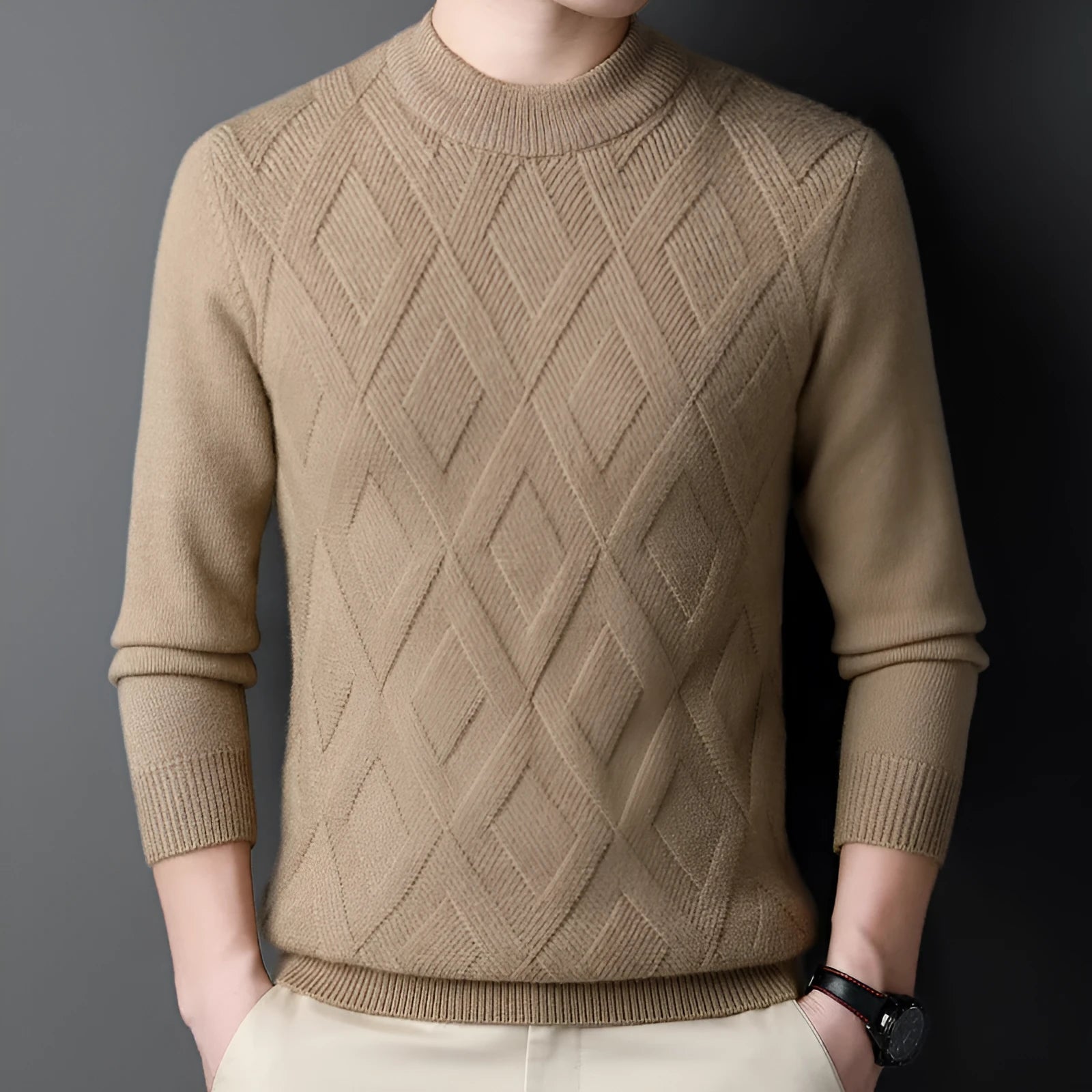 Man wearing a thick grey diamond jacquard knit pullover sweater.