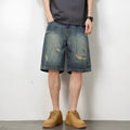 Blue retro-style men's denim shorts with a loose fit, distressed holes, and a straight-leg cut.