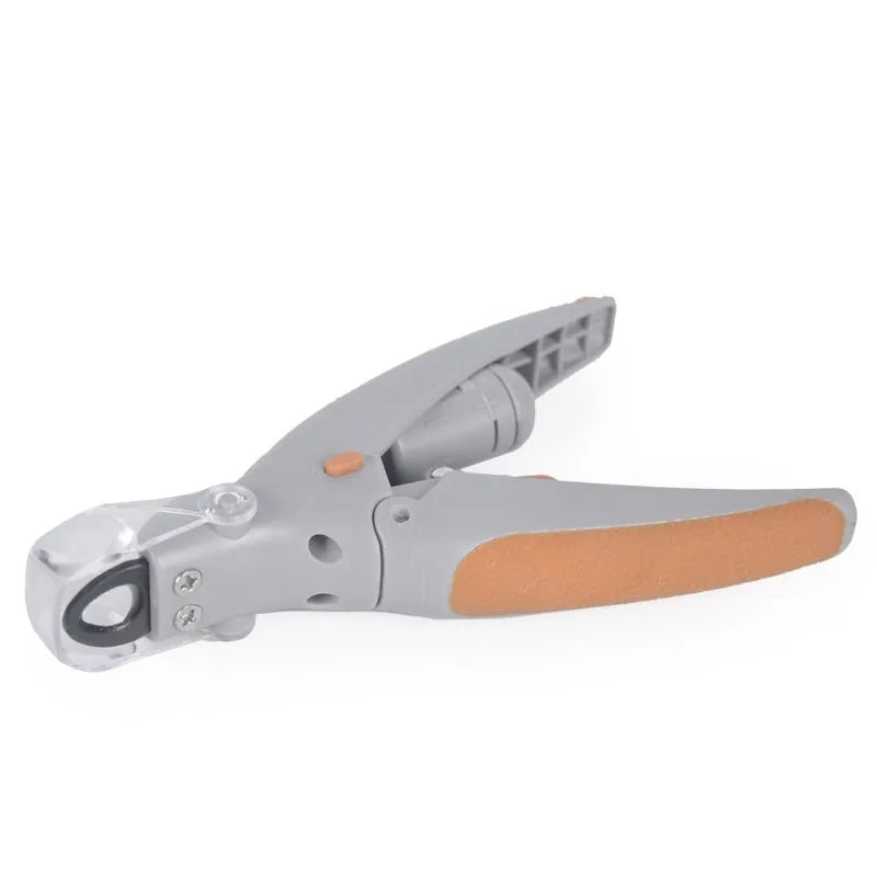 White dog nail clipper with LED light, safety guard, and three LR44 batteries on a blister card.