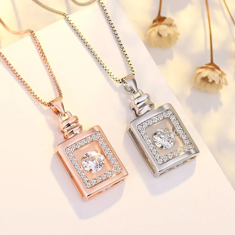 Women's silver heart-shaped pendant necklace with crown and bow decoration on a delicate chain.