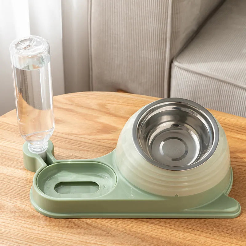 Brown elevated cat food bowl with attached water bottle dispenser on a floor.