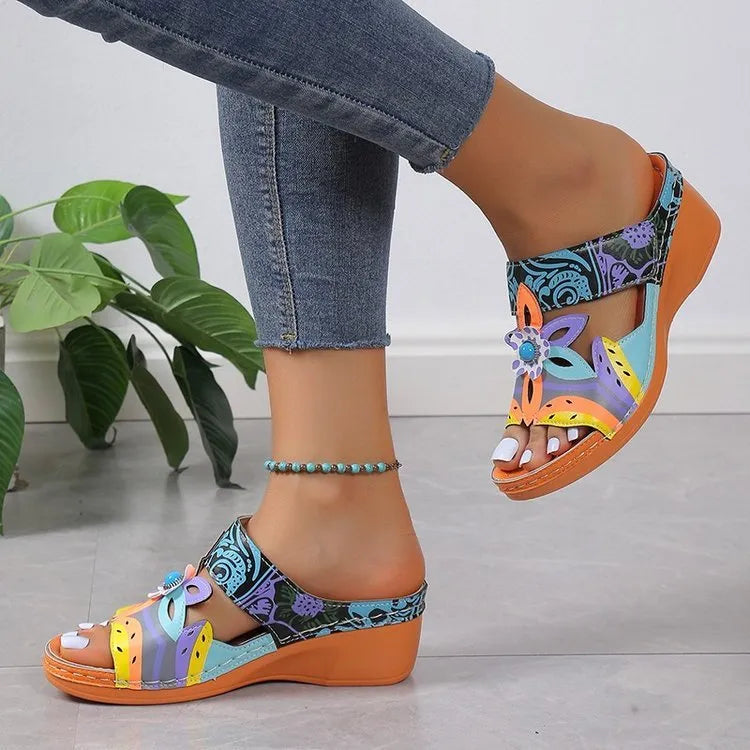 Colourful totem design slope heel sandals for women with cowhide upper and rubber sole.
