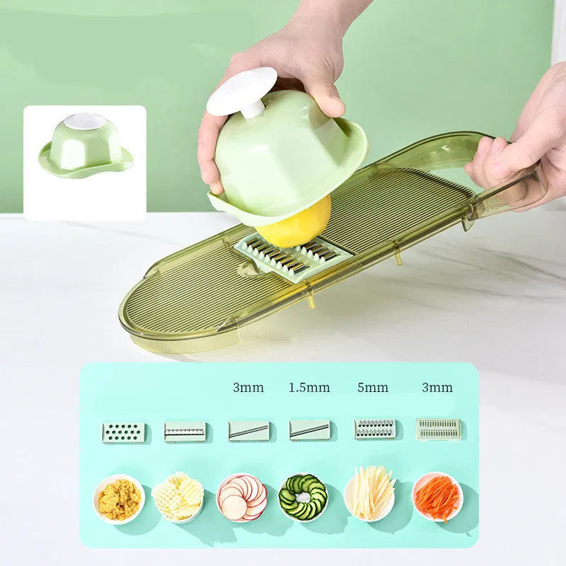 Transparent green vegetable cutter with stainless steel blades and optional drain basket