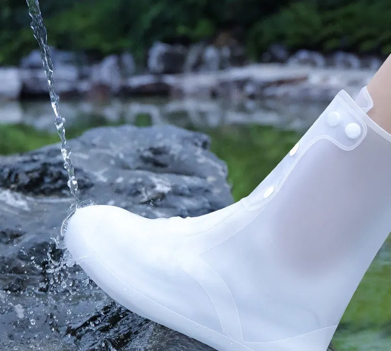 White PVC high top women's water resistant shoe covers with anti-skid soles shown in size options