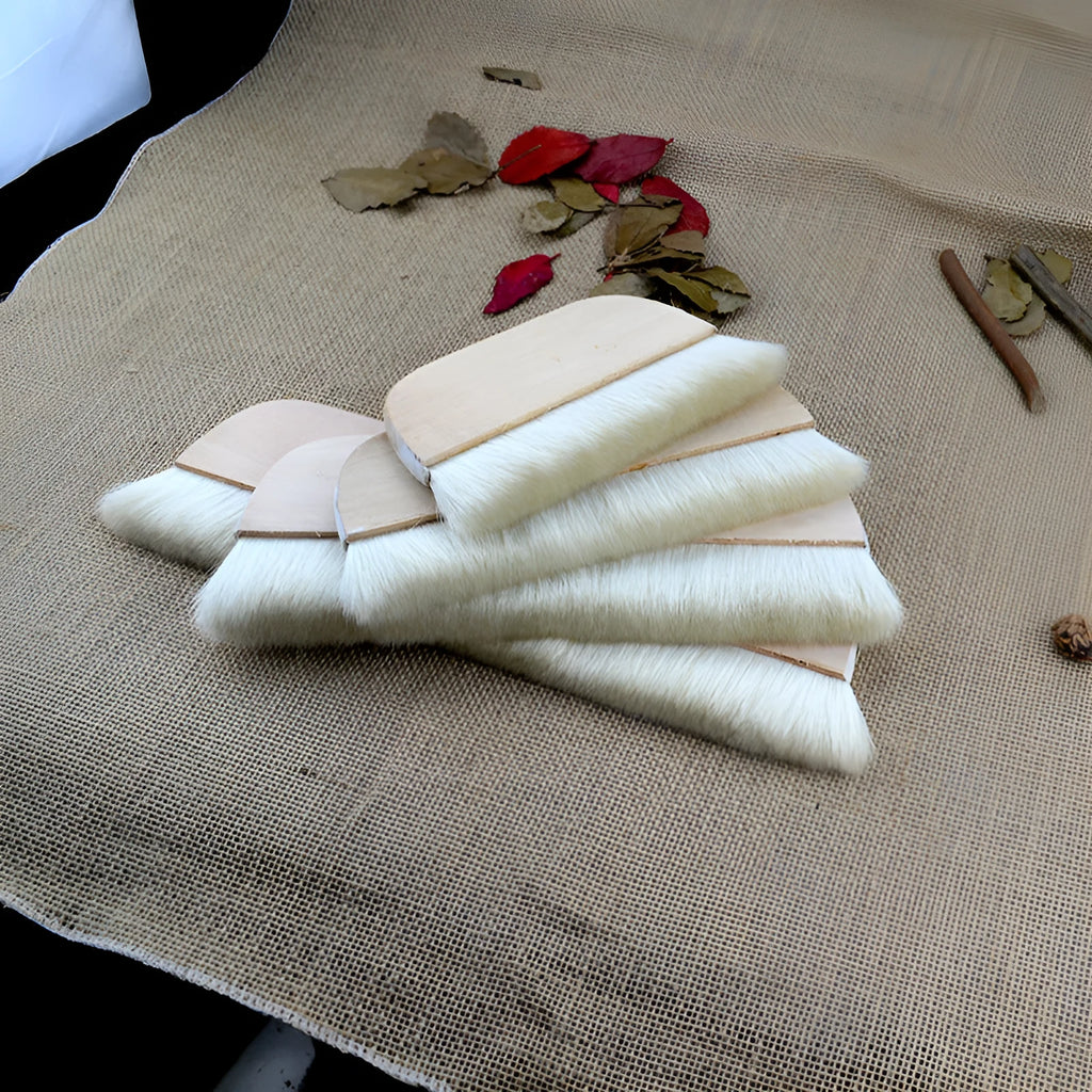 Wool fibre art brush for mounting paste and shading in picture colour.