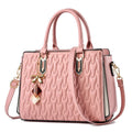 Women's messenger shoulder bag in gold colour showing outer pocket sandwich design and organised interior compartments
