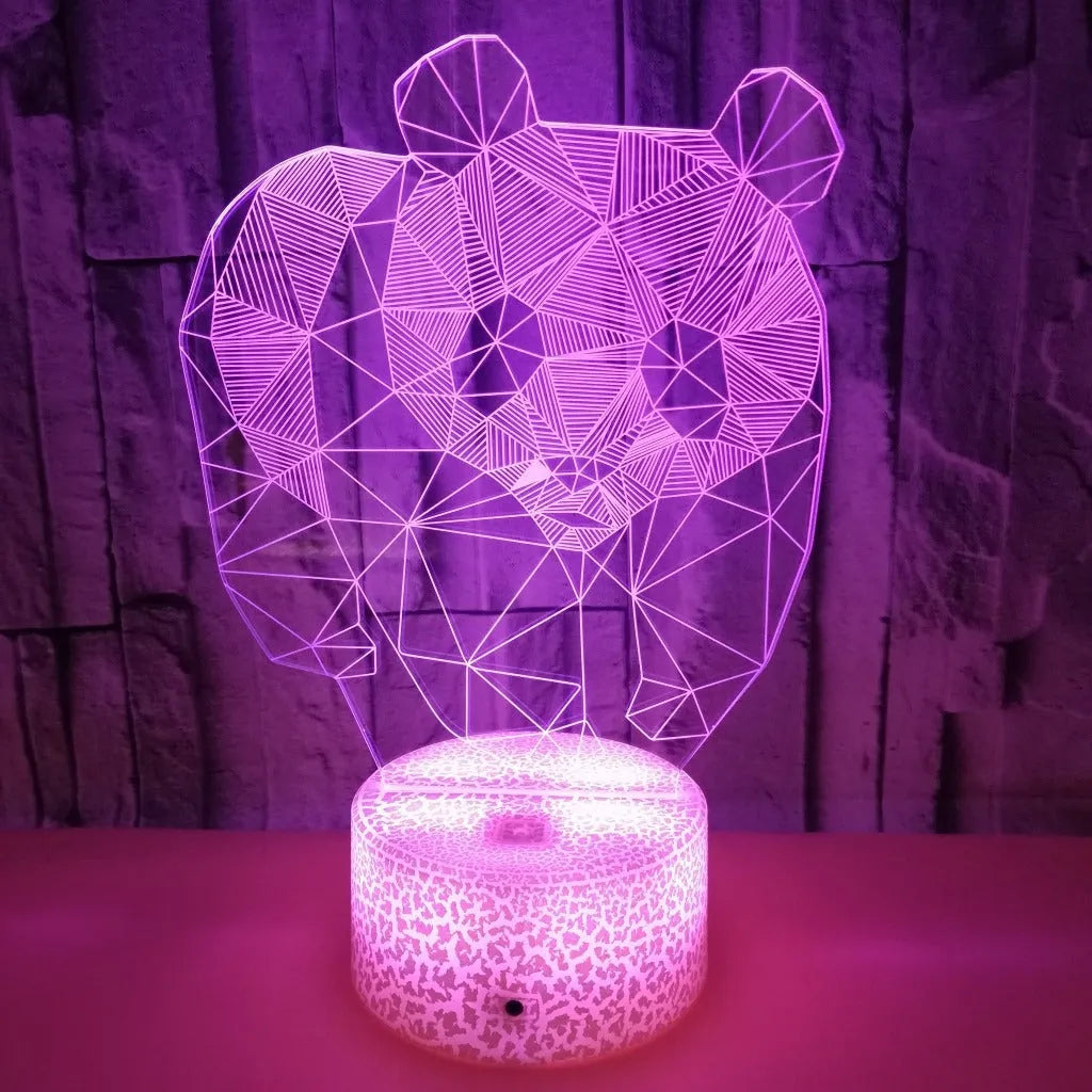 Panda colorful LED 3D night light with remote control showing seven colour gradient on a bedroom shelf