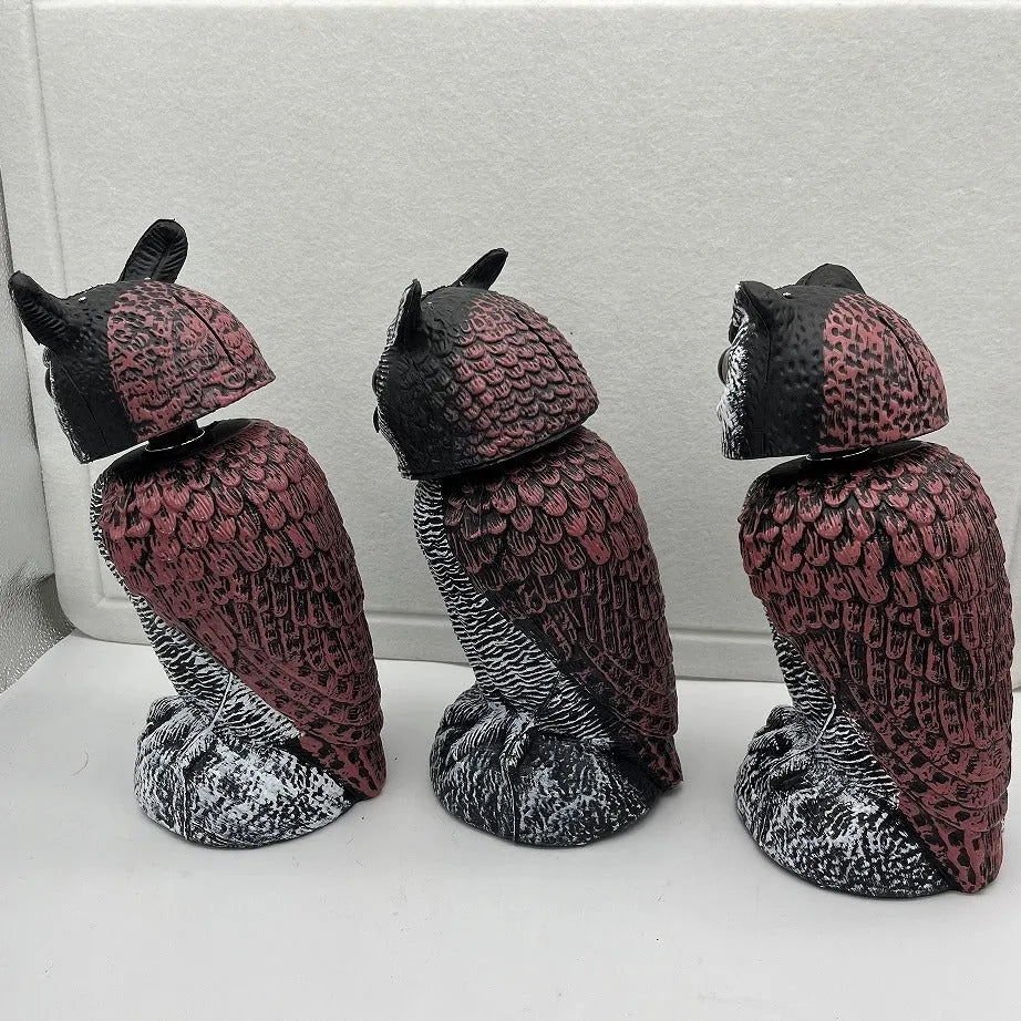 Artificial owl bird scarer decoy with movable head, made from black PE plastic for outdoor use.