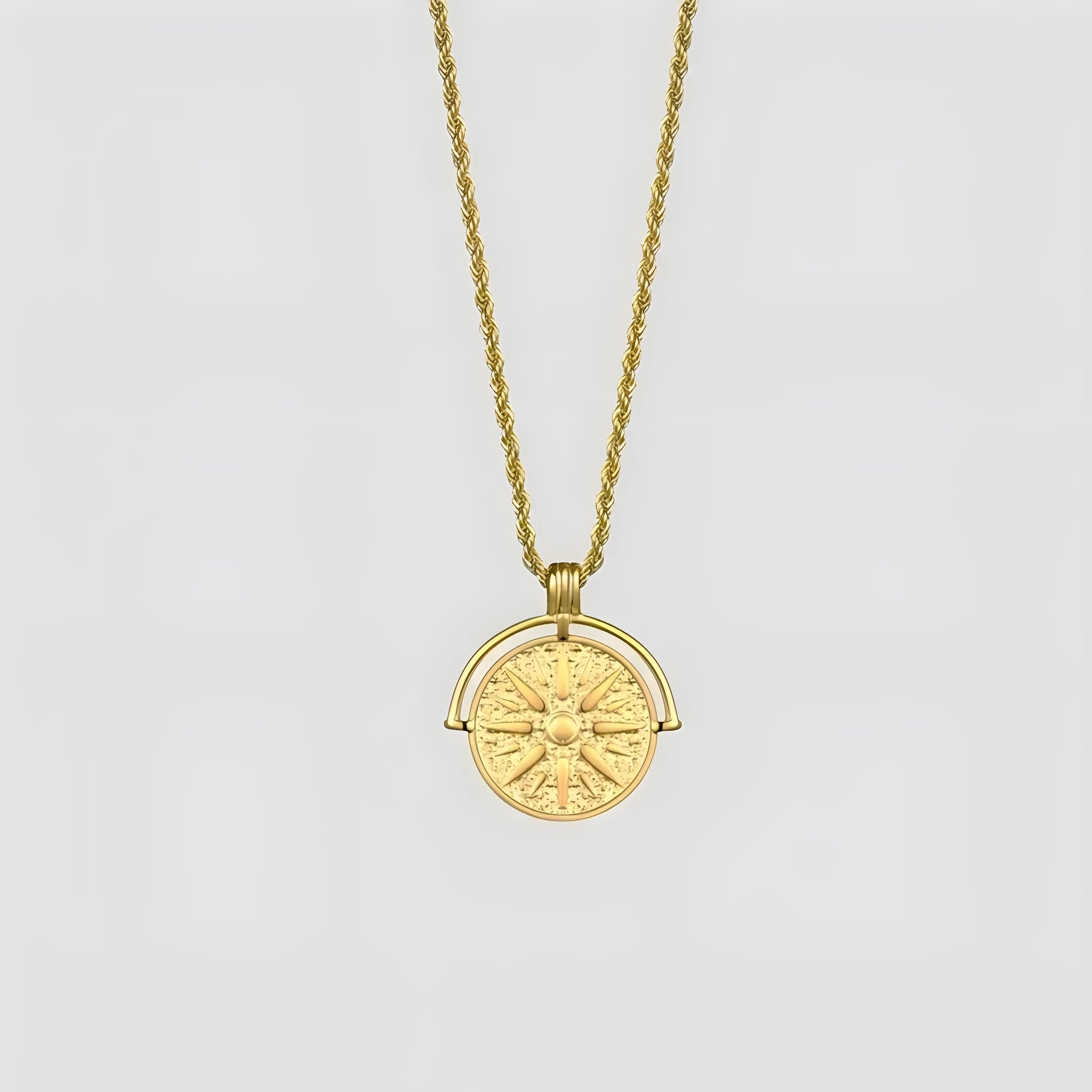 Gold stainless steel sunflower pendant necklace with geometric embossed design on hemp chain