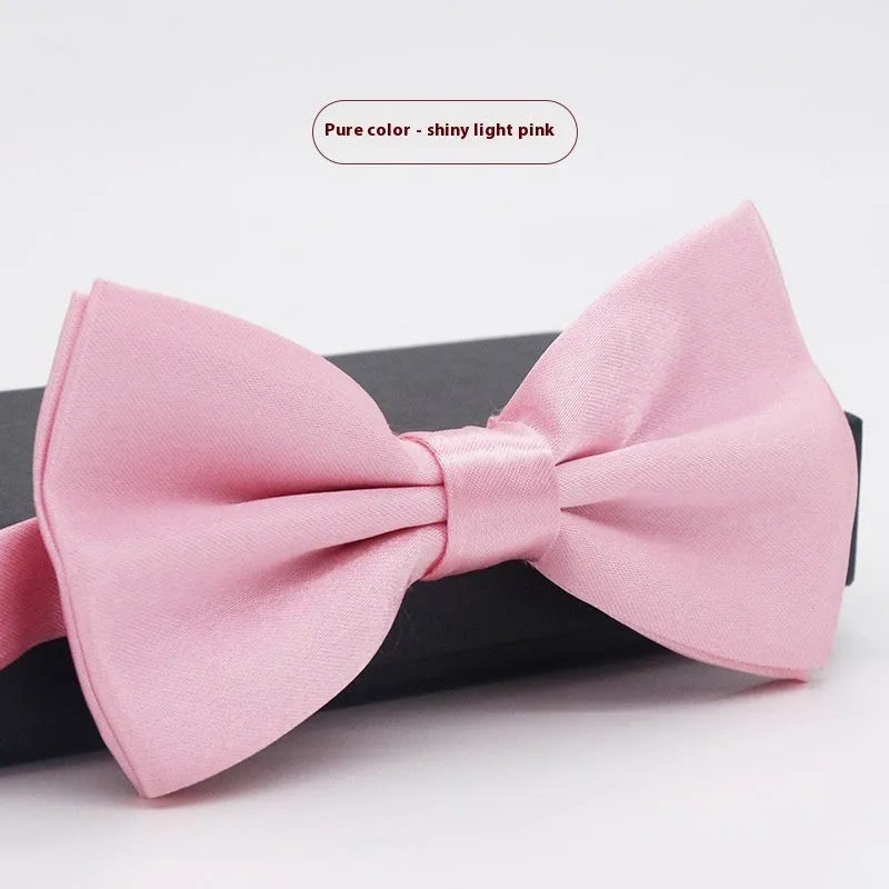 Men's flat head style polyester bow tie in a solid colour, shown with adjustable neck strap.