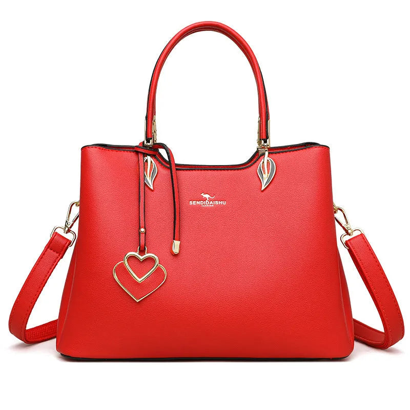 Women's black PU leather multi-compartment shoulder messenger bag with adjustable strap.