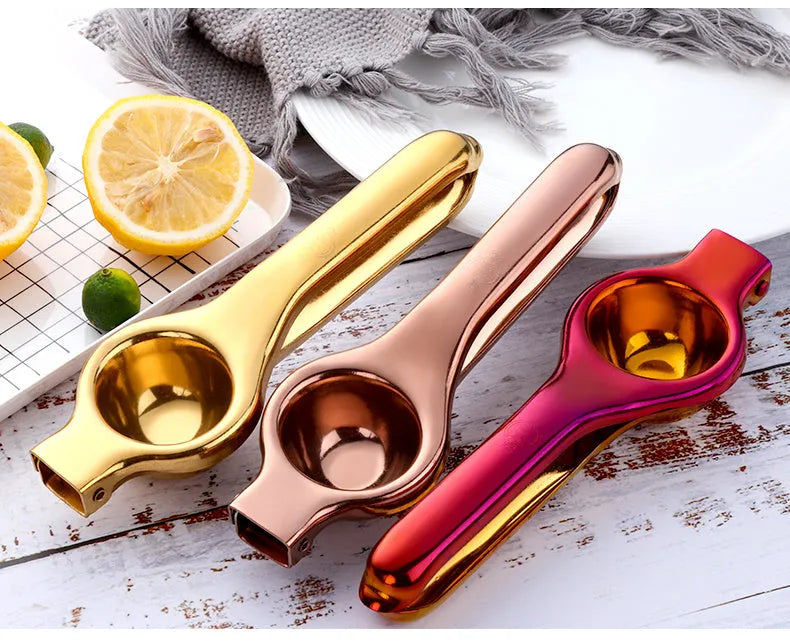 Manual stainless steel citrus juicer with hand press and round feed opening available in multiple colours