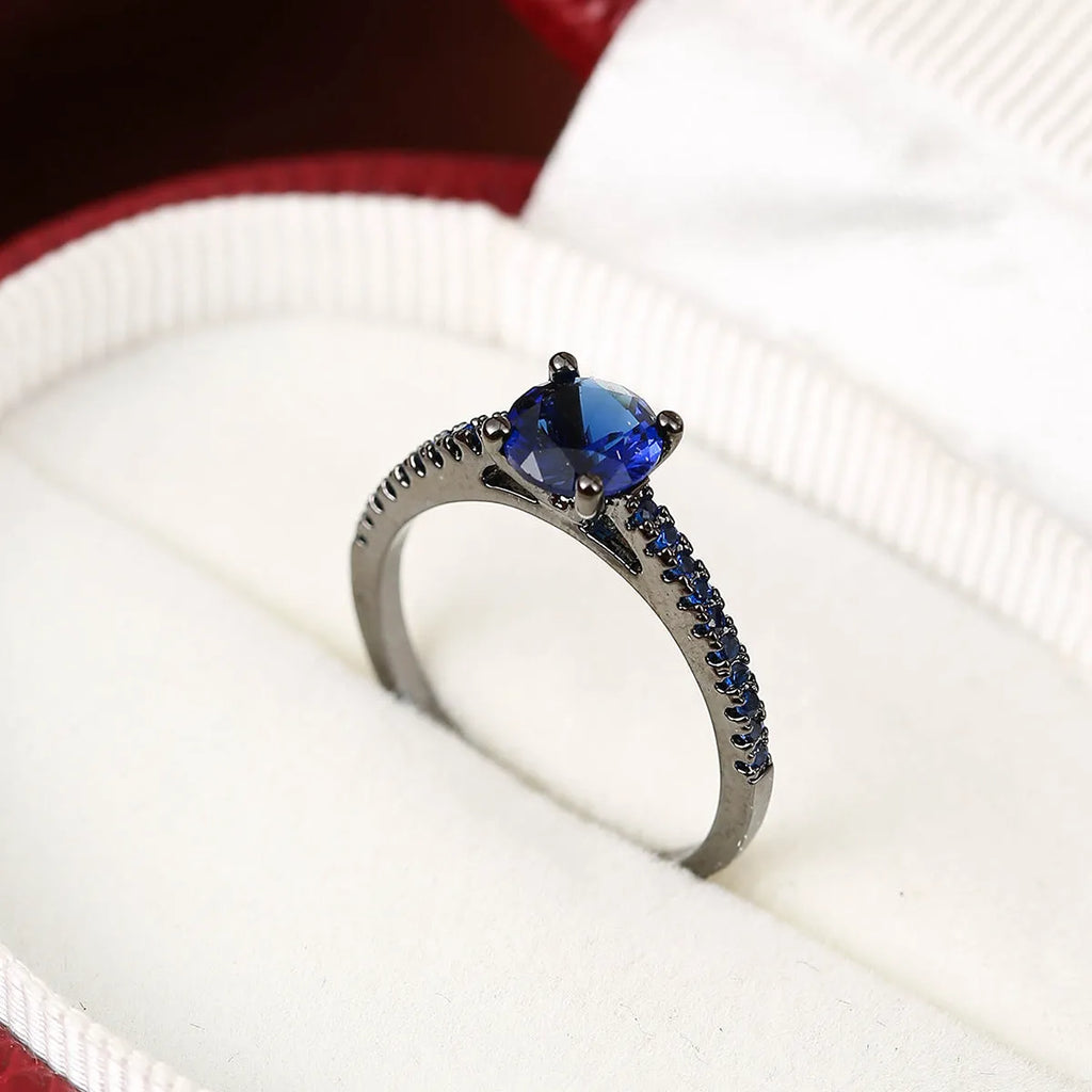 Geometric hexagon copper ring with colourful zircon stones in gold or gun black electroplated finish.