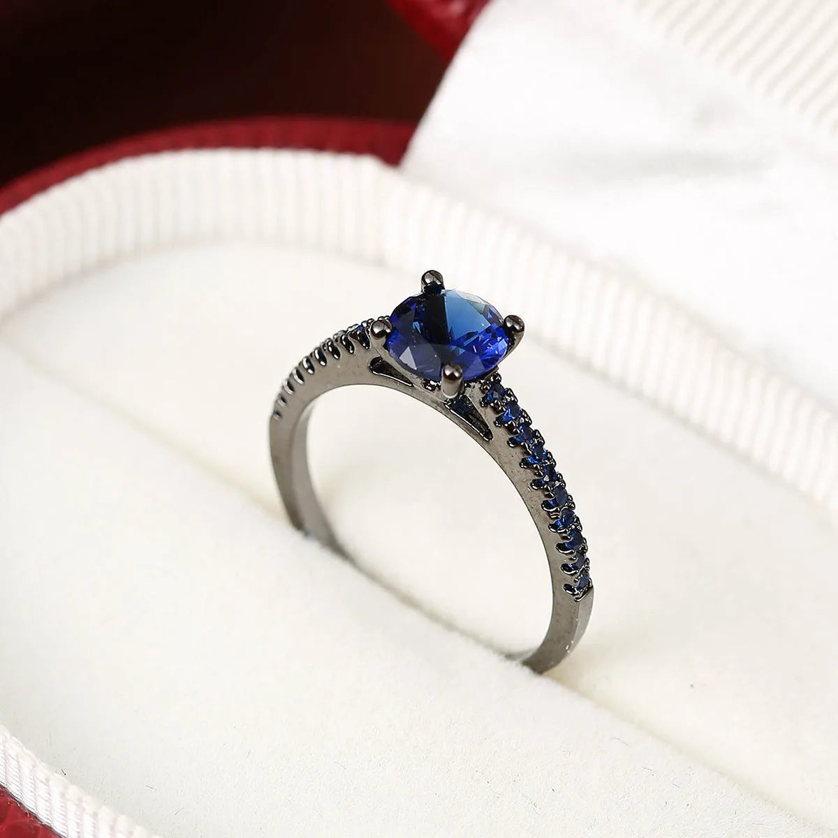 Geometric hexagon copper ring with colourful zircon stones in gold or gun black electroplated finish.