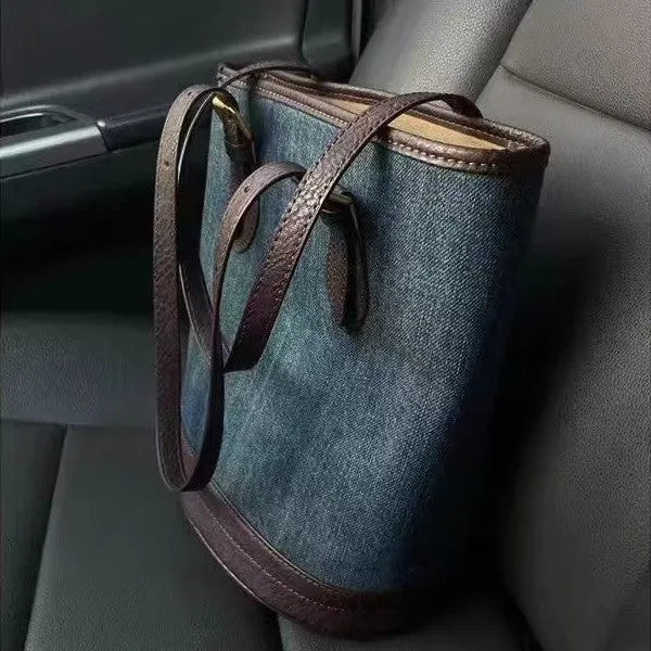Denim patchwork one-shoulder bucket handbag showing dimensions and polyester construction