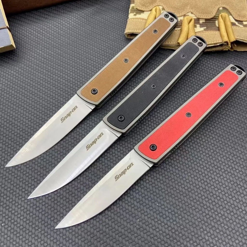 Folding fruit knife with stainless steel blade in black, brown, or red handle colours