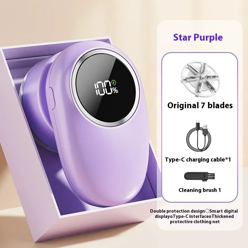 Beige and purple digital fur ball trimmer devices with removable cutter heads on a fabric background