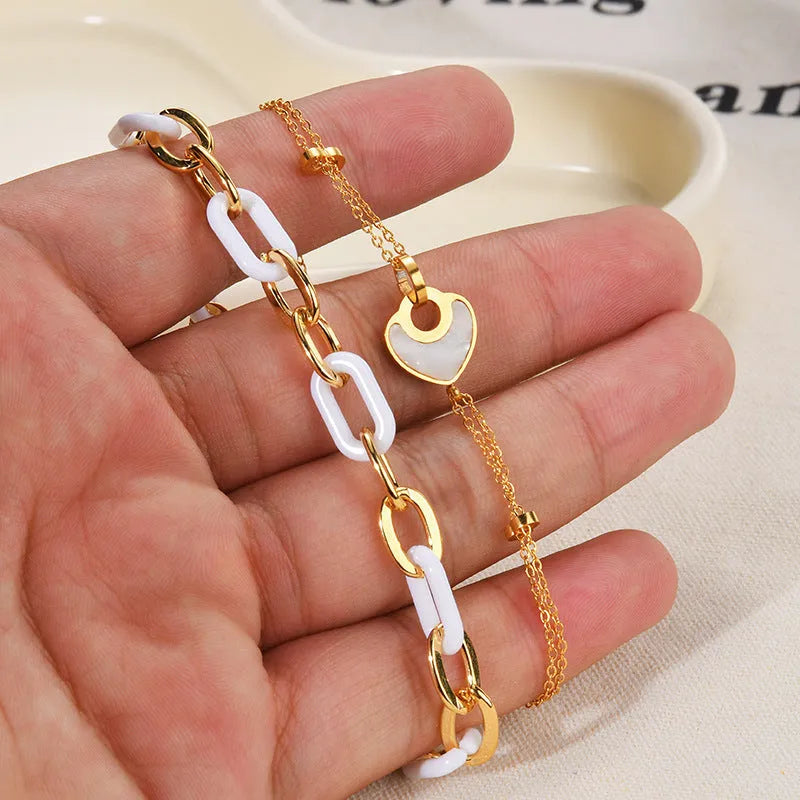 Stainless steel resin bracelet for women featuring heart-shaped design and double-layer construction